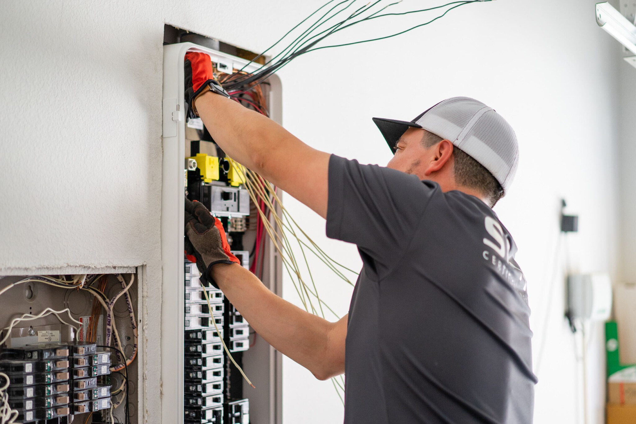 A SPAN-certified electrician installs a SPAN home electrical panel.