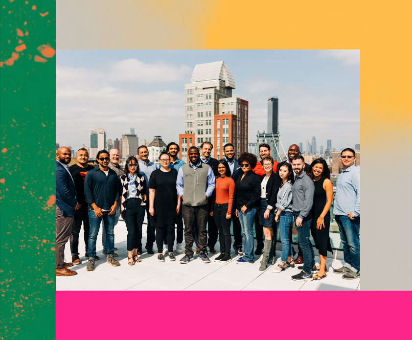 BlocPower team standing on a rooftop in New York City.