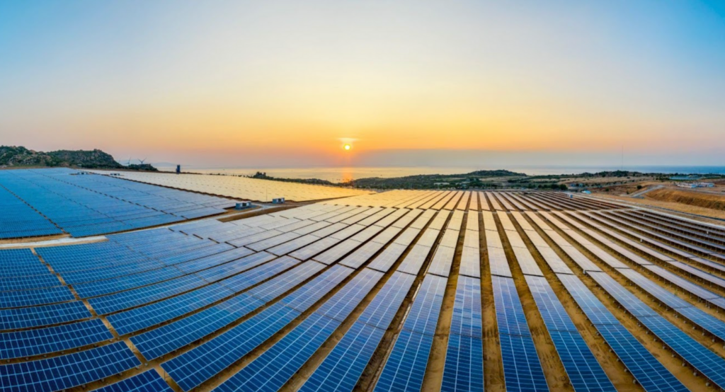 The sun sets over a solar farm